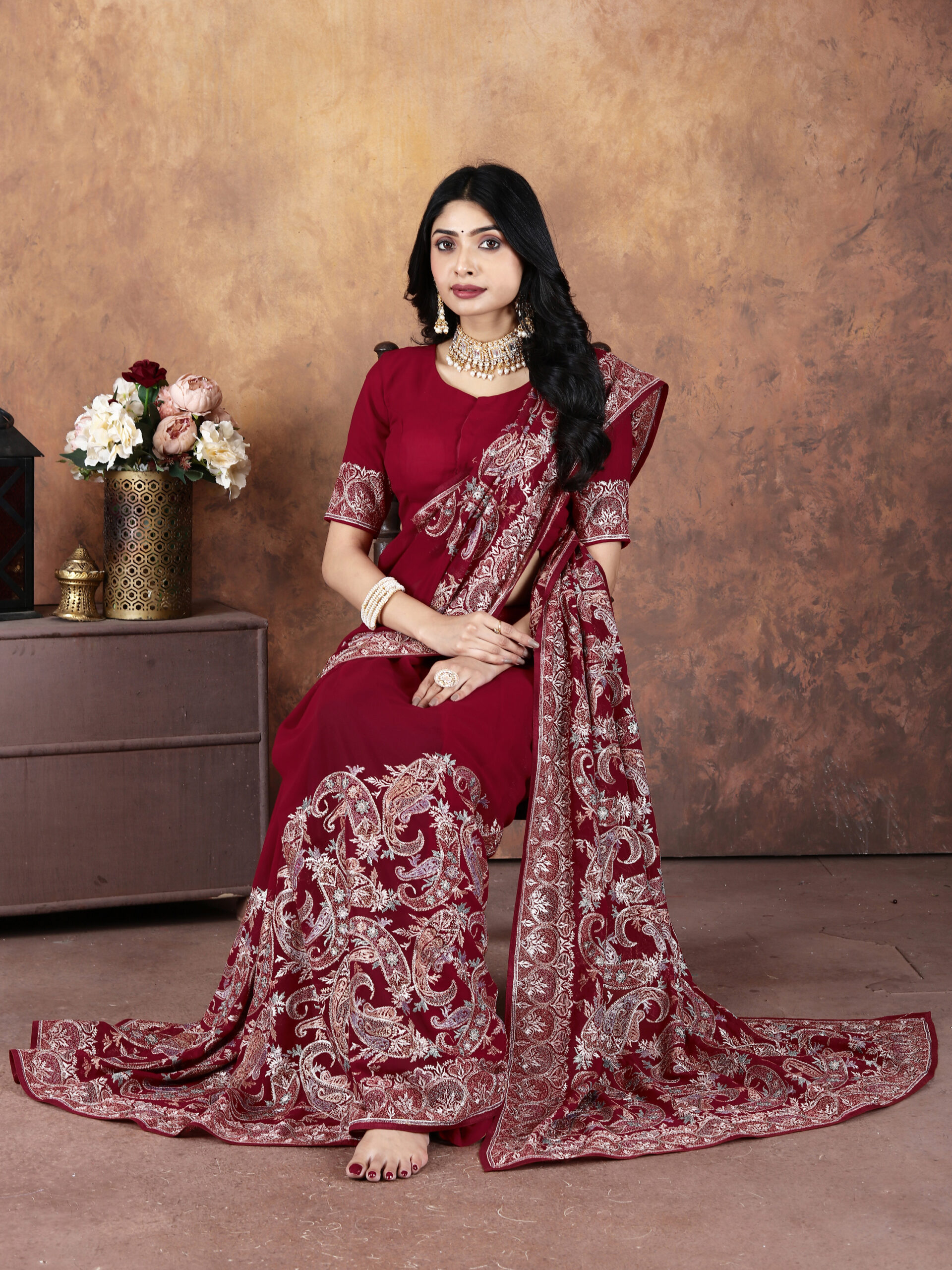 maroon heavy embroidery georgette saree with intricate paisley and floral work by Ritual Styles.
