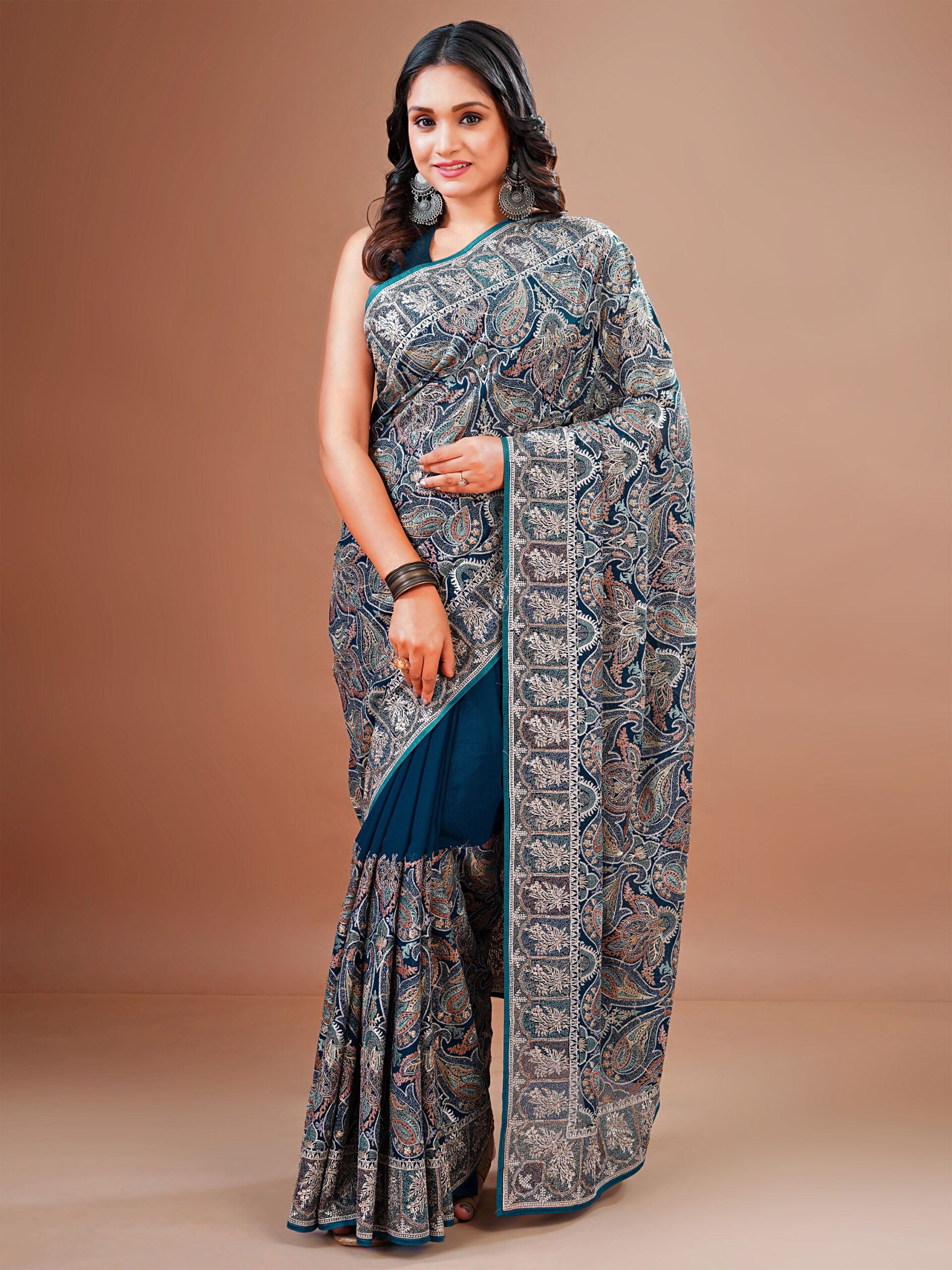 georgette saree with Kashmiri embroidered paisley motifs and a detailed border by Ritual Styles.