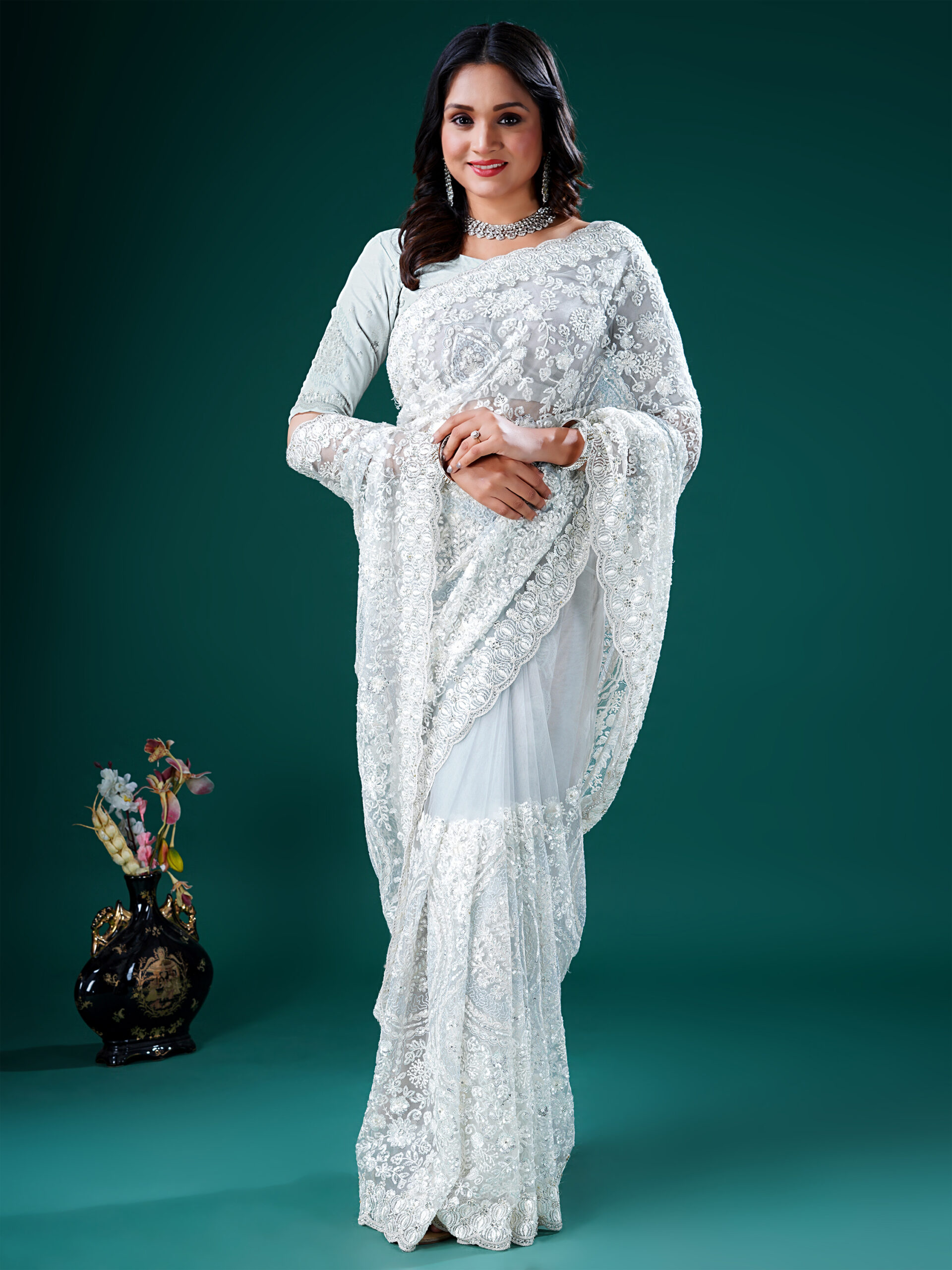net Embroidered saree with floral detailing and scalloped borders by Ritual Styles.