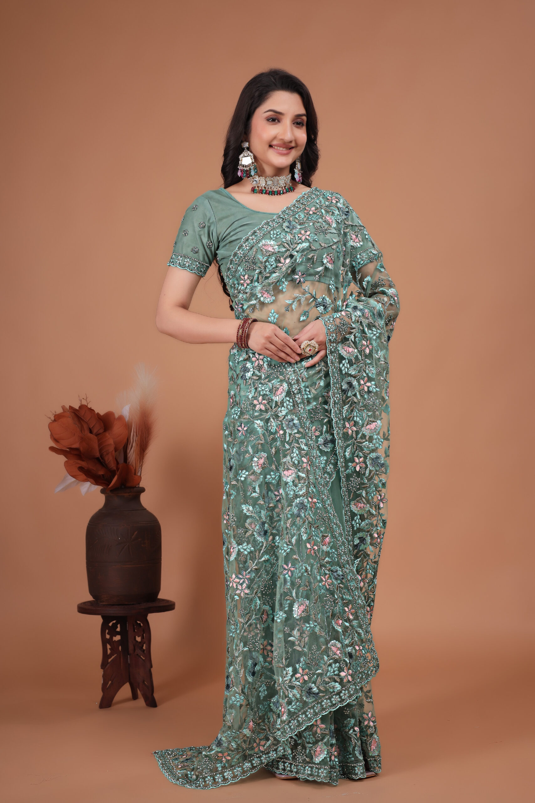 Firozi Net Saree with heavy coding embroidery and Swarovski work by Ritual Styles.