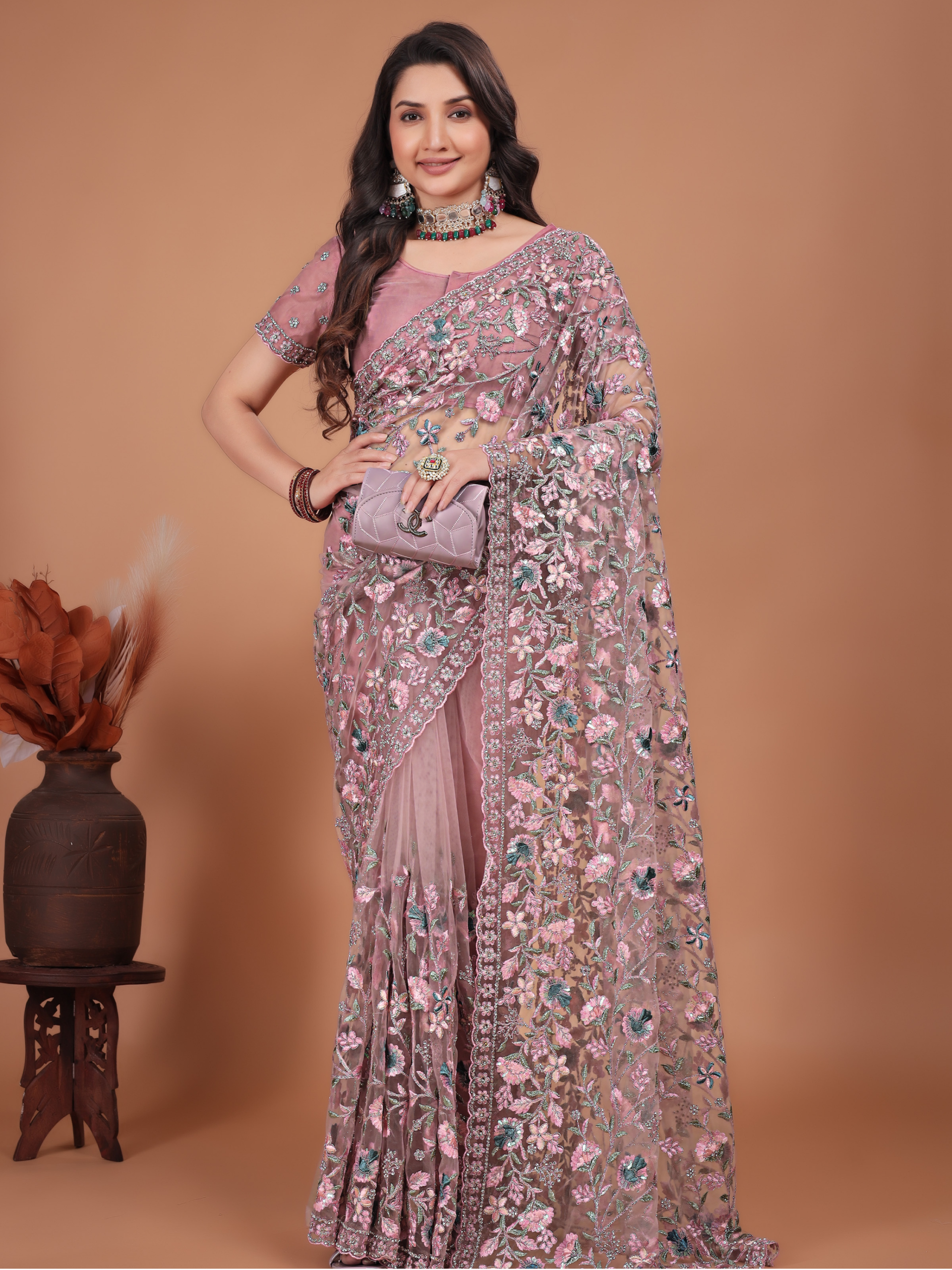 pink net saree with coding embroidery and Swarovski work by Ritual Styles.